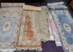 Rugs - various Chinese carpets, runners and rugs including a Chinese oval woollen rug, with