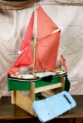 A large wooden pond yacht,  with masts, sails and rigging, with painted hull and deck, 77cm wide,