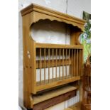 A farmhouse pine wall hanging plate rack, 83cm high, 68cm wide