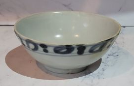 The Tek Sing Cargo, Shipwreck Porcelain - a Chinese porcelain tea bowl, painted in underglaze