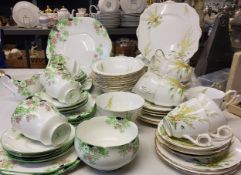 A Crown Staffordshire Broom pattern tea service, for nine, comprising teacups, saucers, side plates,