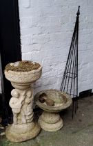 A small reconstituted stone campana shaped bird bath, another larger with figural putti plinth (used