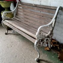 An early 20th century cast metal " Sandringham "garden bench, slatted back, lion mask arm rest