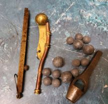 An unusual percussion cap spring loaded dispenser;  a brass and copper bosun`s whistle;  a musket