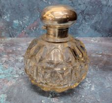 A silver and cut glass dressing scent bottle, hinged silver domed cover, complete with stopper,