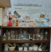 A large collection of Victorian and later pharmaceutical apothecary bottles, cream jars and pestle