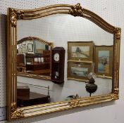 A large decorative gilt over mantel mirror, acanthus capped to frame with double 'antique' foxed