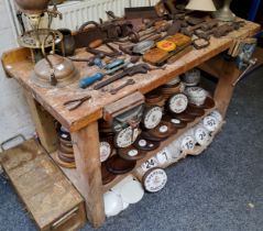 A workshop work bench fitted with vices