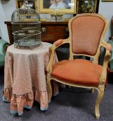 A Louis XVI style 'limed oak' armchair, terracotta and gold upholstery; a sorcerer's type circular