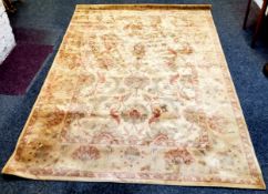 A large 20th century Persian Ziegler style wool pile carpet in tones of gold and terracotta