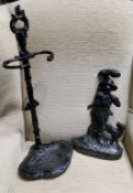 A Victorian style cast iron stick stand, 64cm high;  an iron door stop, cast with forester and his