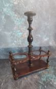 A 19th century French rosewood two-bottle decanter stand, turned posted ebony handle, 30cm high, c.