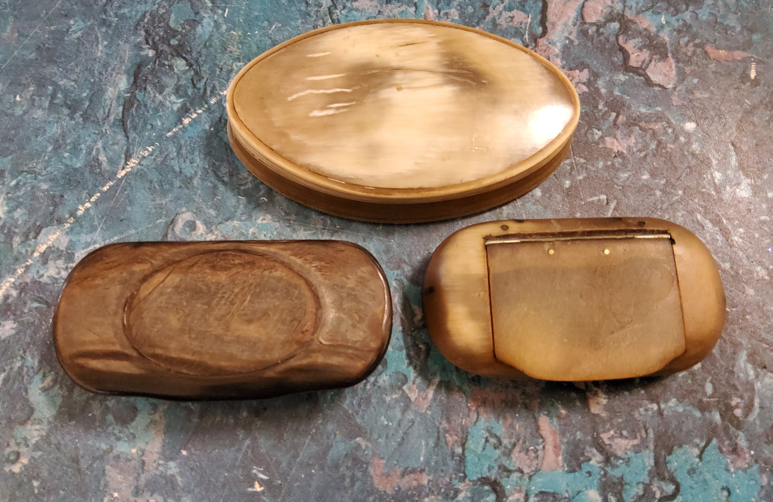 A 19th century horn oval snuff box, 6.5cm wide, c.1880;  others (3)