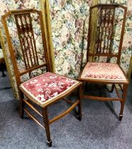 A pair of Edwardian Sheraton Revival mahogany, walnut and satinwood inlaid bedroom chairs c.1905