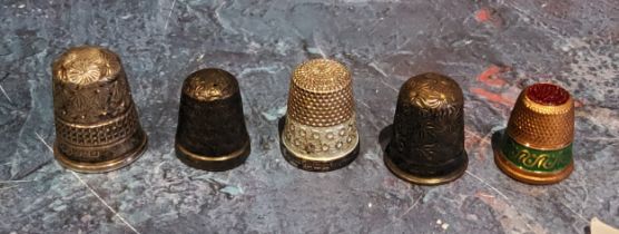 A silver thimble, London 1905;  others;  a gilt and enamel thimble (5)