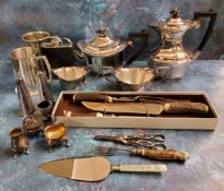 Plate Ware - an E.P.N.S.  four piece tea service;  cruet sets;  horn hafted carving set; grape