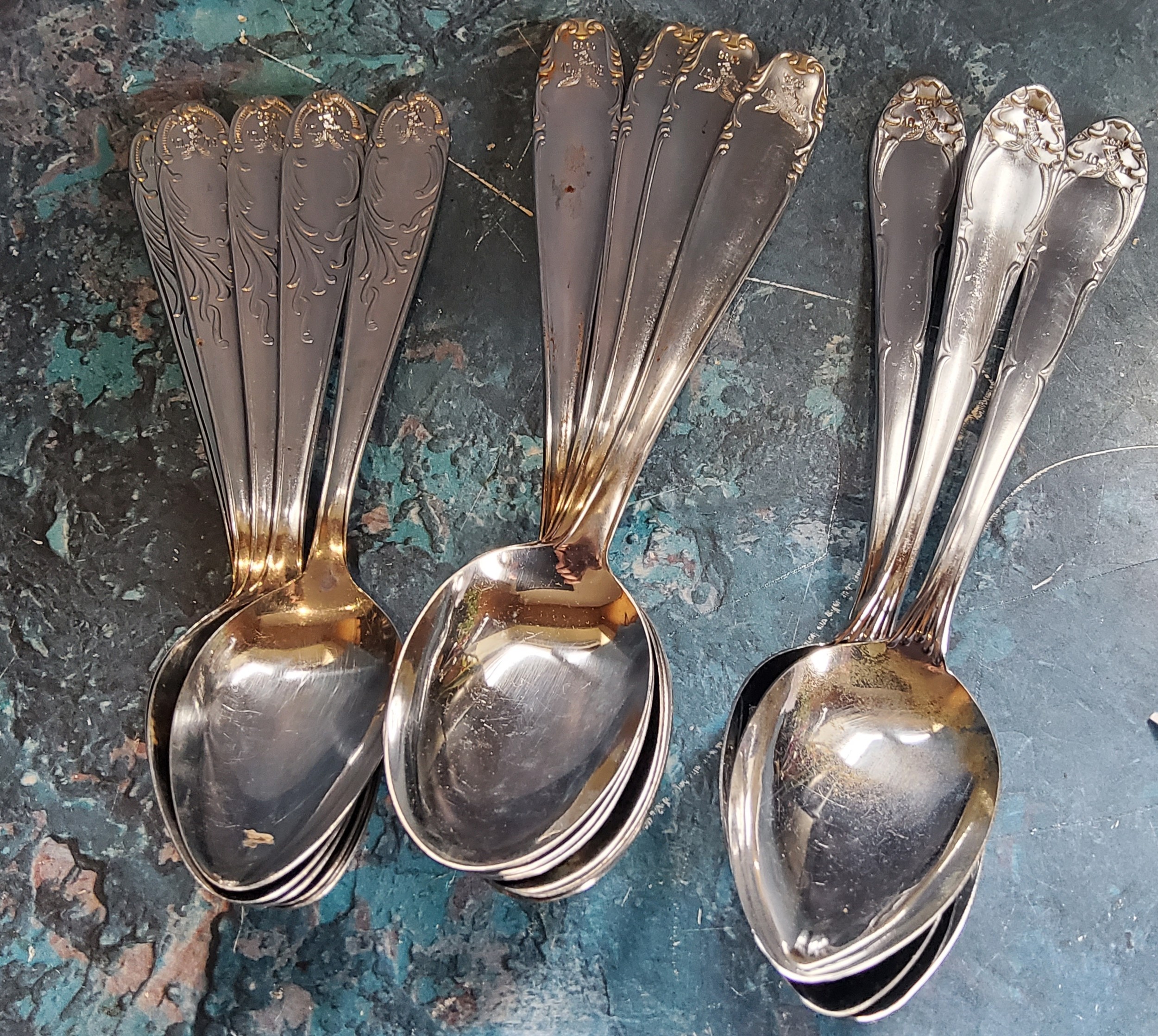 World War II - three  German table spoons and nine dessert spoons, each stamped with Third Reich
