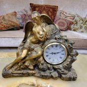 A Victorian style gilt 'bronzed' figural mantel clock, with circular dial inscribed W Widdop,