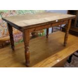 A Victorian farmhouse pine scrub top table, turned legs c.1880