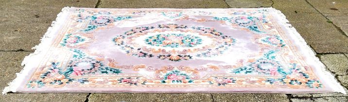 A substantial Chinese wool pile carpet in tones of cream, pink and gold approximately 300cm long x