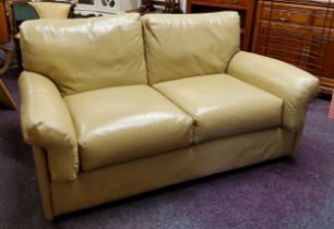 A mid 20th century low studio sofa in vintage butterscotch upholstery