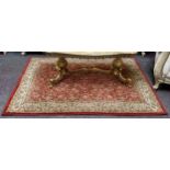 A small 20th century Persian rug, vivid tones of red, ivory and gold