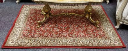 A small 20th century Persian rug, vivid tones of red, ivory and gold