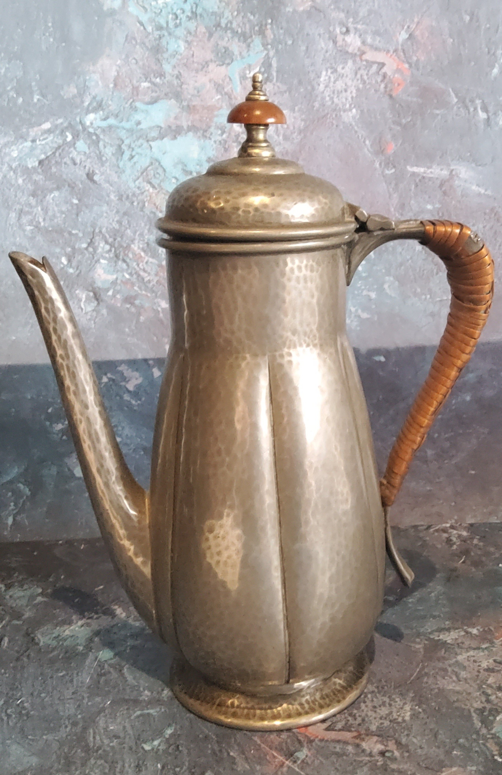 A Liberty Pewter coffee pot, lobed and planished, wicker handle, 22cm high, 01385