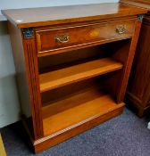 A 20th century yew open bookcase, possible Minster, single drawer inlaid with a batwing patera,