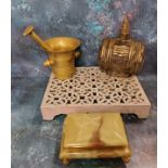 A brass pestle and mortar, 11.5cm high;  an onyx cigarette box;  a cast ironstep, 30cm x 23cm;  a