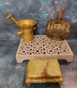 A brass pestle and mortar, 11.5cm high;  an onyx cigarette box;  a cast ironstep, 30cm x 23cm;  a