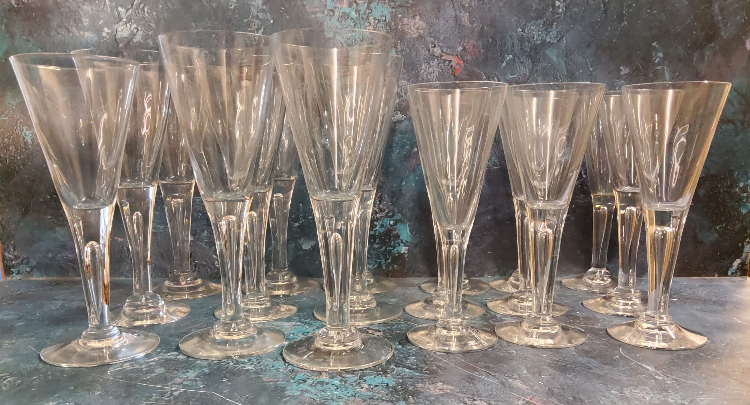 A set of nine Dartington crystal Sharon wine glasses, conical bowls, bubbled stems, 22cm high;  nine