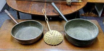 A Victorian copper roll top pan, metal handle, 31cm wide, c.1860;  another, turned wooden handle