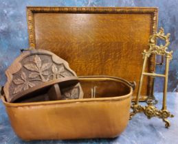 An early 20th century oak rectangular tray, 58cm wide, c.1930;  a carved oak wall hanging shelf;