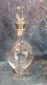A silver mounted clear glass globular decanter and stopper, 30cm high, London 1998