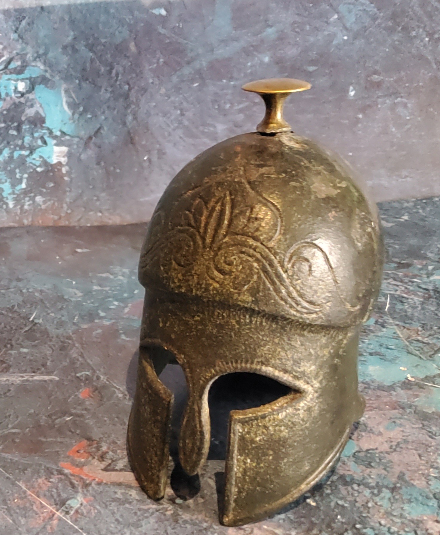 A Grand Tour novelty desk weight, in the form of an Ancient Greek helmet, 12cm high