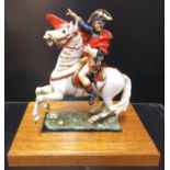 A handpainted die-cast figure of Napoleon on horseback based on the painting by Jacques-Louis David,