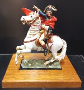 A handpainted die-cast figure of Napoleon on horseback based on the painting by Jacques-Louis David,