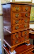 A 20th century Minster yew miniature tallboy side chest, of two short and three long drawers, the