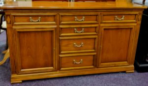 A substantial reproduction Italian sideboard by SELVA, ribbon tied swag drop handles, three