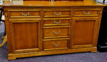 A substantial reproduction Italian sideboard by SELVA, ribbon tied swag drop handles, three