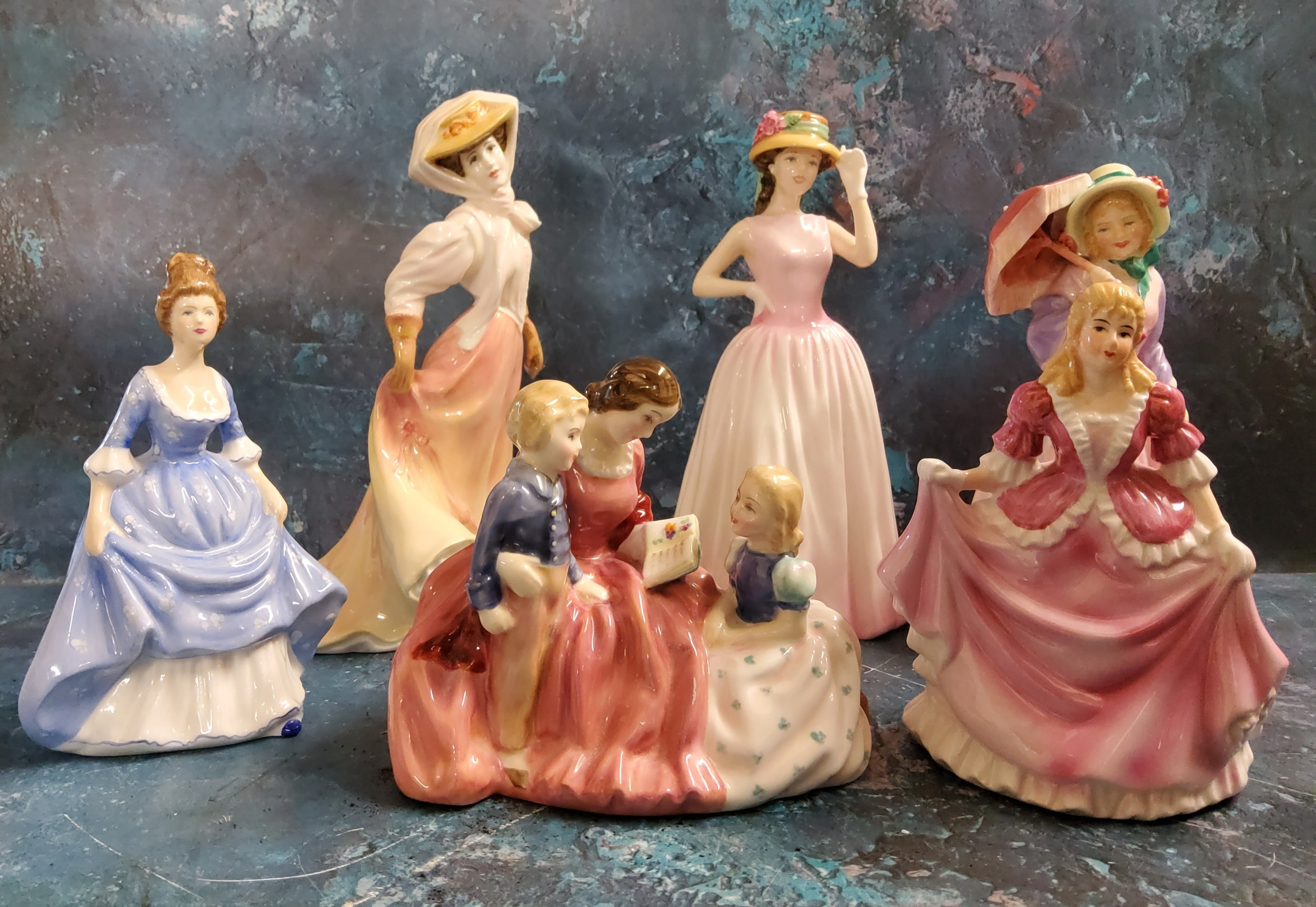 A Royal Doulton figure, Bedtime Story, HN2059;   The Open Road, HN4161;   Miss Demure, HN1402;