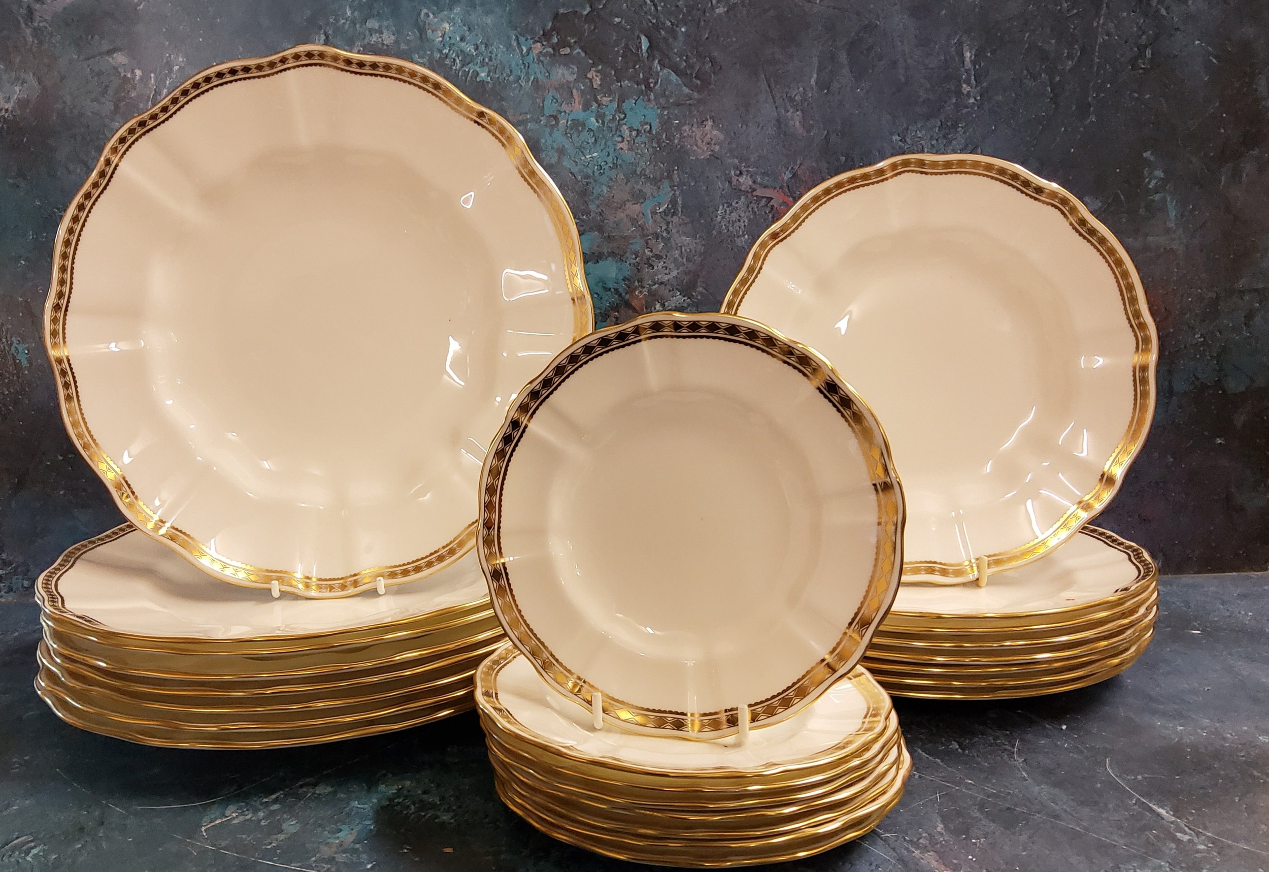 A Royal Crown Derby Carlton Gold pattern dinner service, for eight, comprising dinner, dessert and