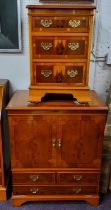 A 20th century yew side cabinet, with two doors above  faux drawers, 90cm high, 74cm wide;