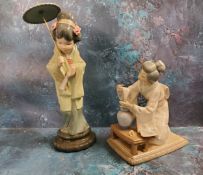 A Lladro figure of a Geisha, standing holding a fan, 32cm high, printed mark;  another, of a lady