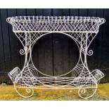 An ornate 20th century metal plant stand, painted white