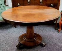 A George III Regency Cuban mahogany tilt top centre table, conical octagonal support, turned to base