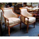 A pair of Louis XVI style side chairs, scroll backs, arms and legs, upholstered in cream damask,