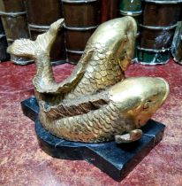 An unusual bronze desk weight, Pisces, cast with two gilt bronze fish, shaped marble base, 18cm wide