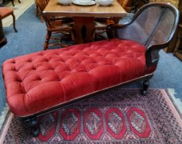 A 19th century chaise lounge, deep buttoned maroon upholstery with bergere headrest c.1860